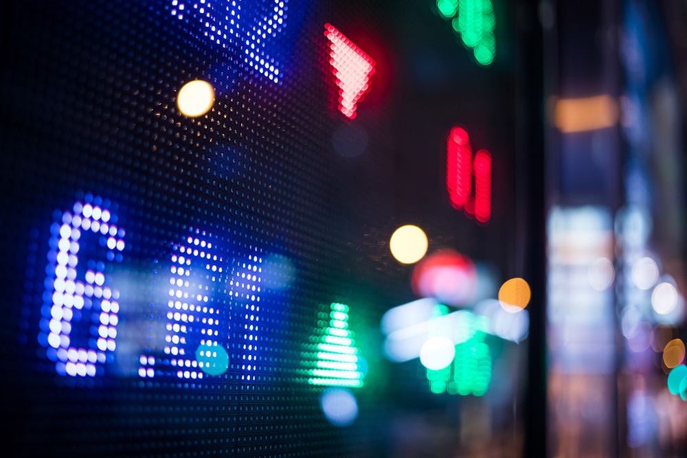 Financial Stock Market Numbers And City Light Reflection